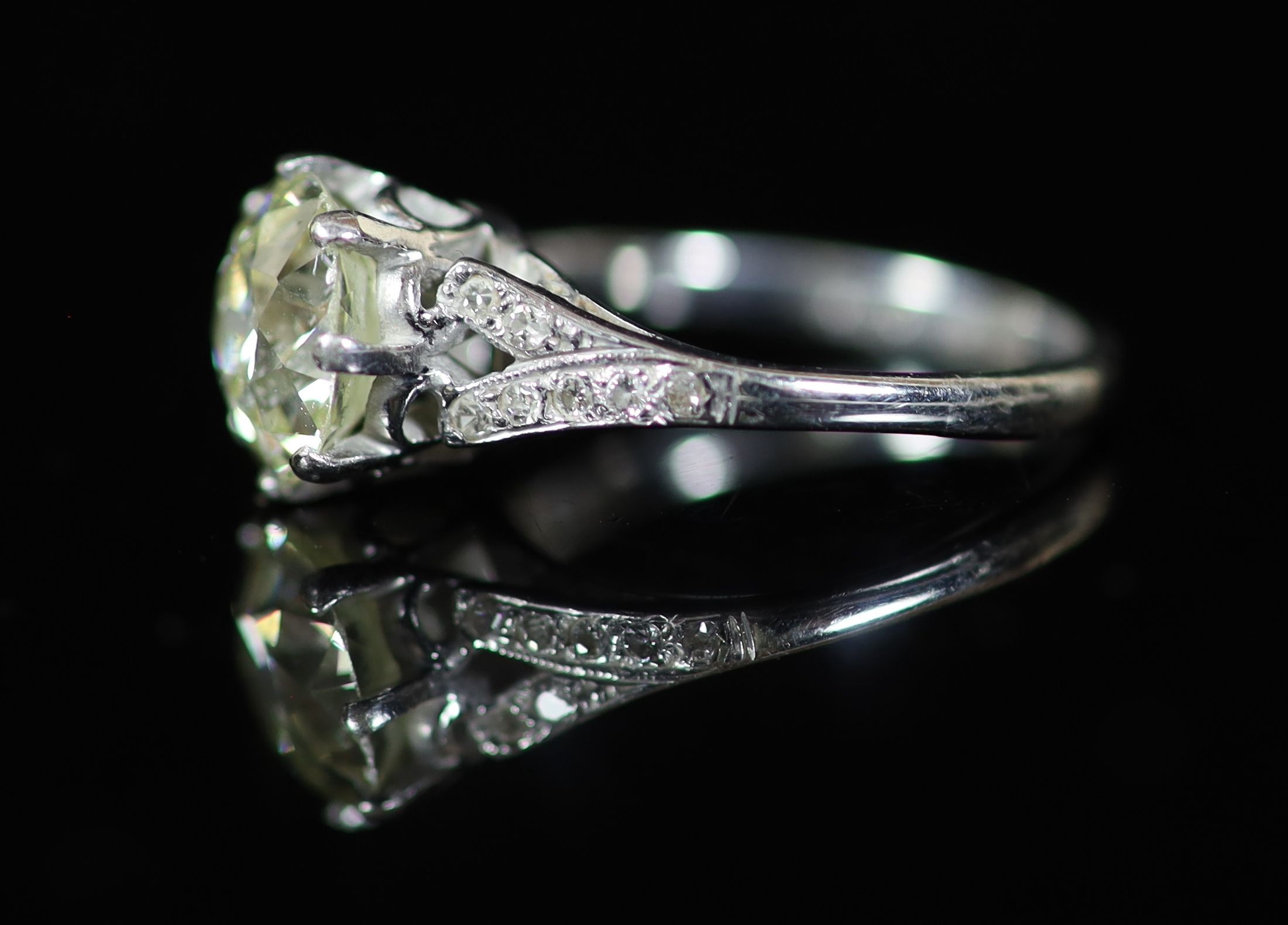 A 20th century 18ct white gold and platinum set single stone diamond ring, with diamond set shoulders